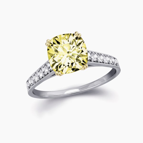 Our Anais Setting, a diamond band engagement ring using a cushion cut yellow diamond.
