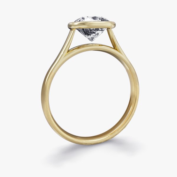 Side view of our Esmee Setting, a Diamond Engagement Ring featuring a Cushion Cut Diamond in a Rubover Setting.