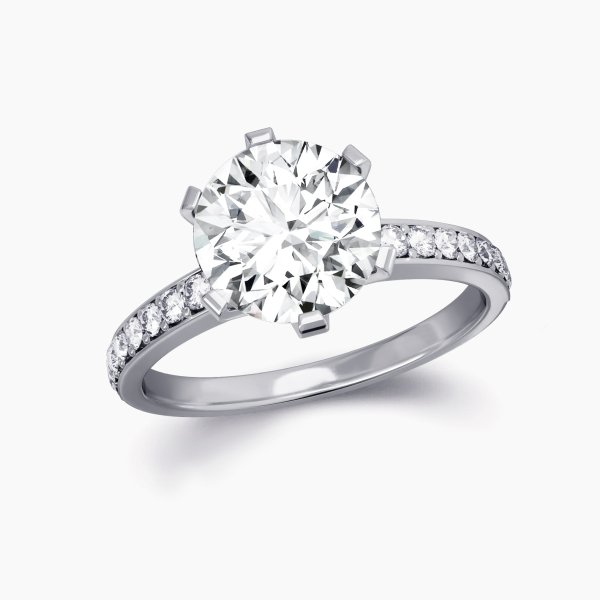Our Harlow setting is a classic 6 claw engagement ring featuring a channel set diamond band
