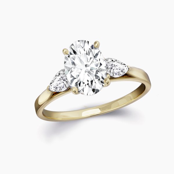 Our Martel Setting is a three stone engagement ring shown here with an oval cut diamond with two pears