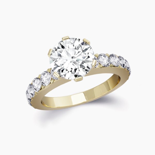 Our Pavia Setting is a diamond band solitaire engagement ring featuring a generous width of band. This design uses a round brilliant diamond