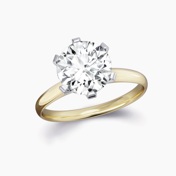 Our regent setting featuring a round brilliant diamond and platinum setting wtih an 18ct yellow gold band.