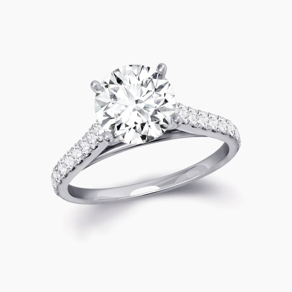 Our Rue Cler Setting is a diamond band solitaire engagement ring shown here with an round brilliant diamond in platinum.