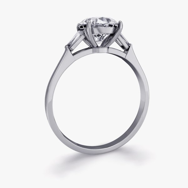 Our Bowery Setting a three stone engagement ring featuring a round brilliant diamond