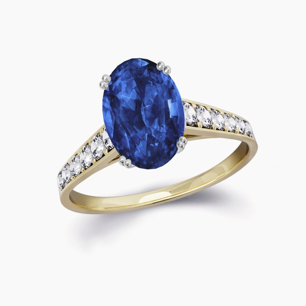 Our Anais Setting is a four claw diamond band engagement ring shown here with an oval cut sapphire