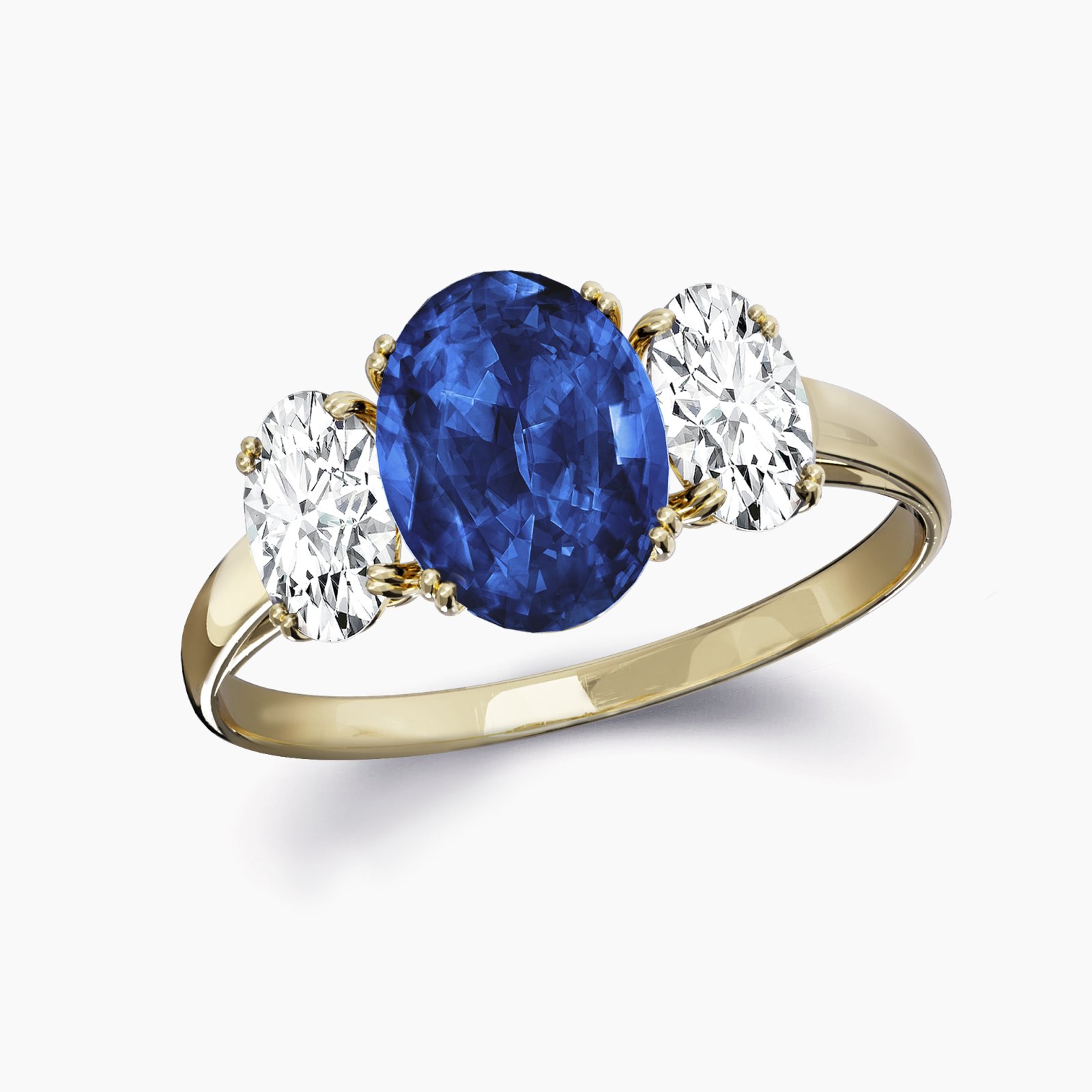 Our Saria Setting, a Three Stone Engagement Ring shown here with an oval cut sapphire and two oval cut complimentary diamonds